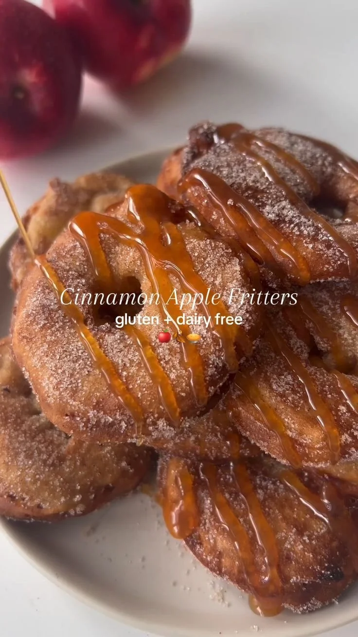 Delicious homemade apple pancakes served on a plate with syrup and sliced apples
