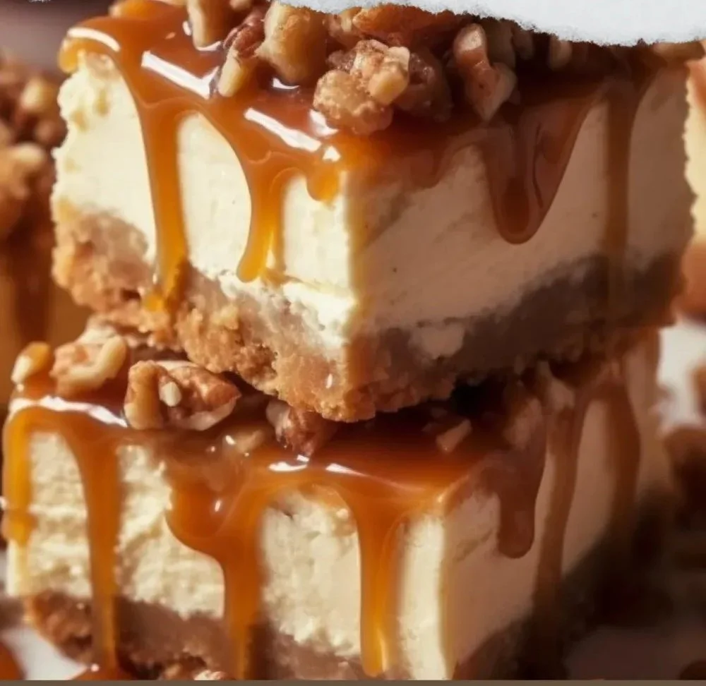 Delicious caramel apple cheesecake bars topped with caramel drizzle.