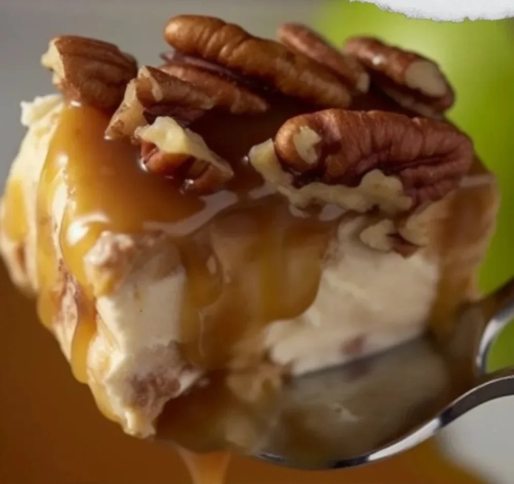 Delicious caramel apple cheesecake dip served in a bowl with apple slices