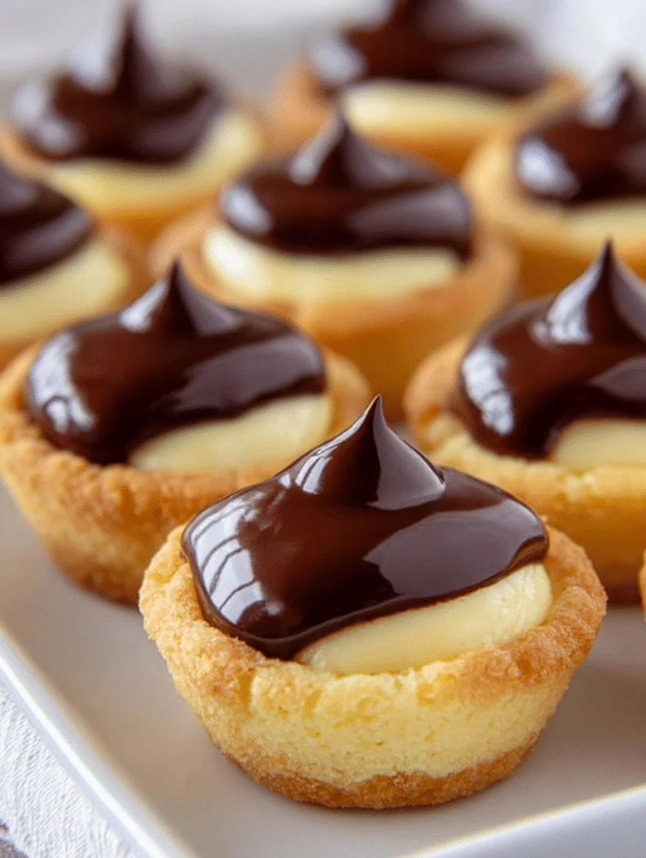 Mini Boston Cream Pie cups served on a white plate with chocolate drizzle