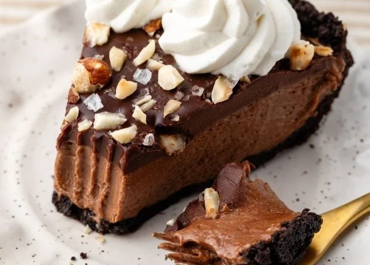 Delicious Nutella Cream Pie topped with chocolate and whipped cream