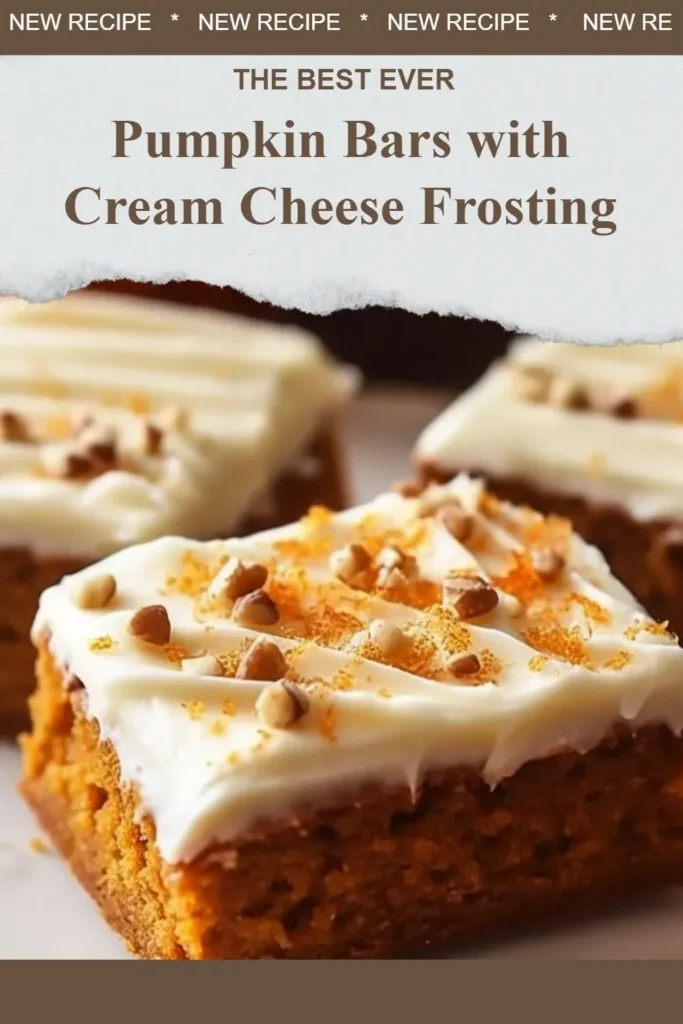 Delicious pumpkin bars with creamy cheese frosting on a rustic wooden table