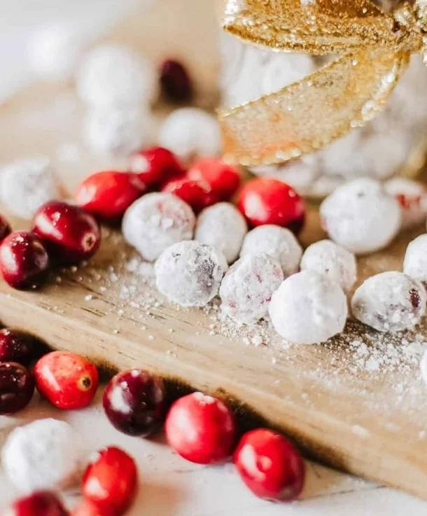 A bowl of sweet and shiny candied cranberries, festive decoration for holidays.
