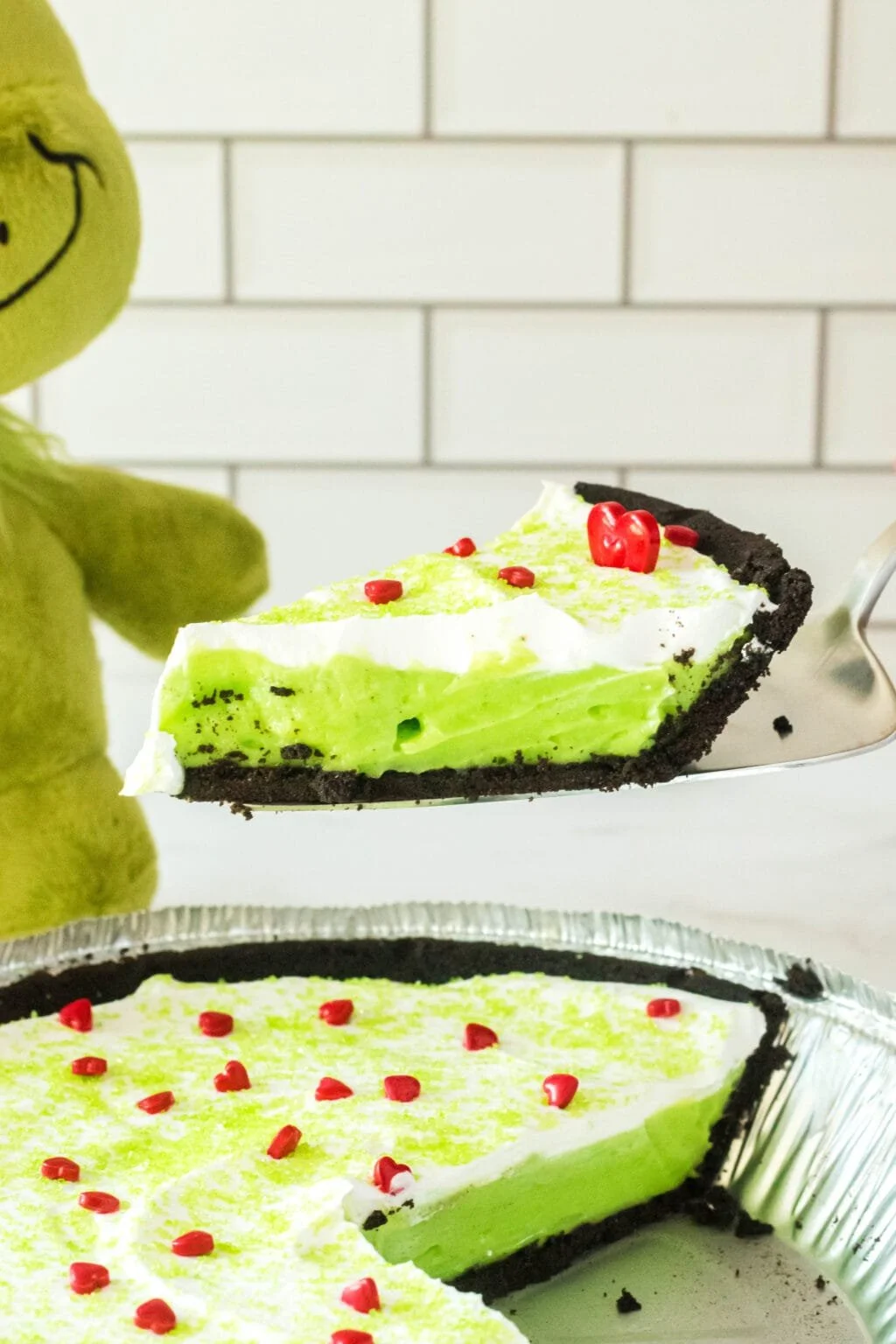 Delicious No Bake Grinch Pie garnished with festive toppings