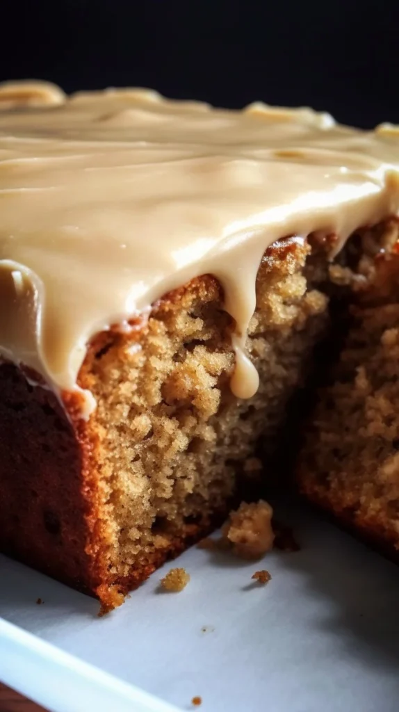 Sweet Glazed Zucchini Cake topped with Brown Sugar Icing on a plate