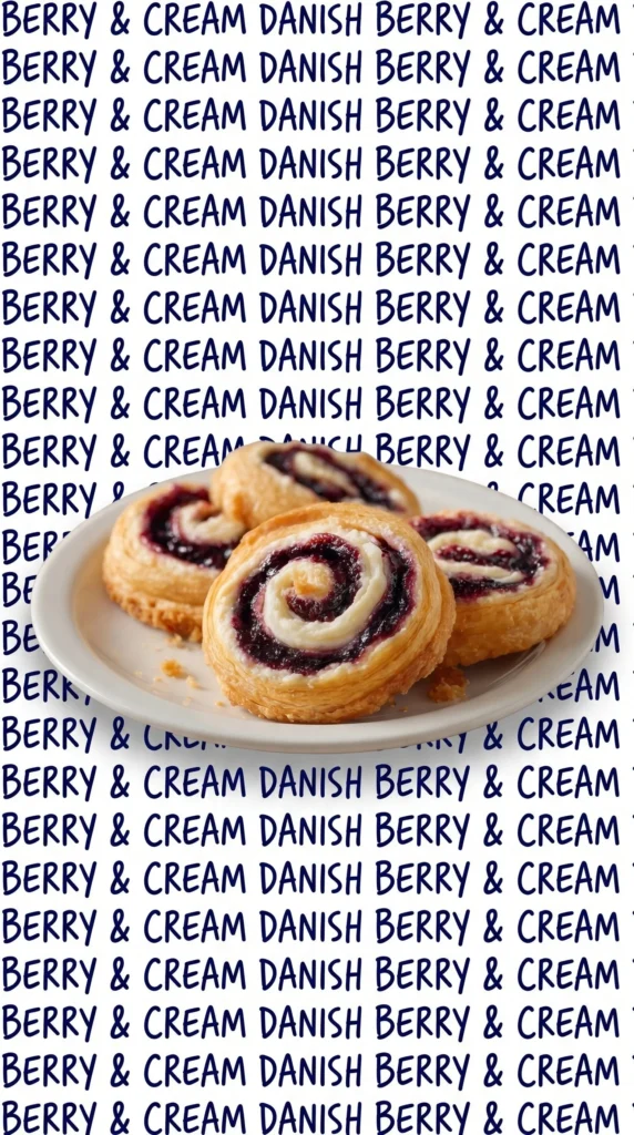 Blueberry cream cheese swirls on a plate, topped with fresh blueberries.