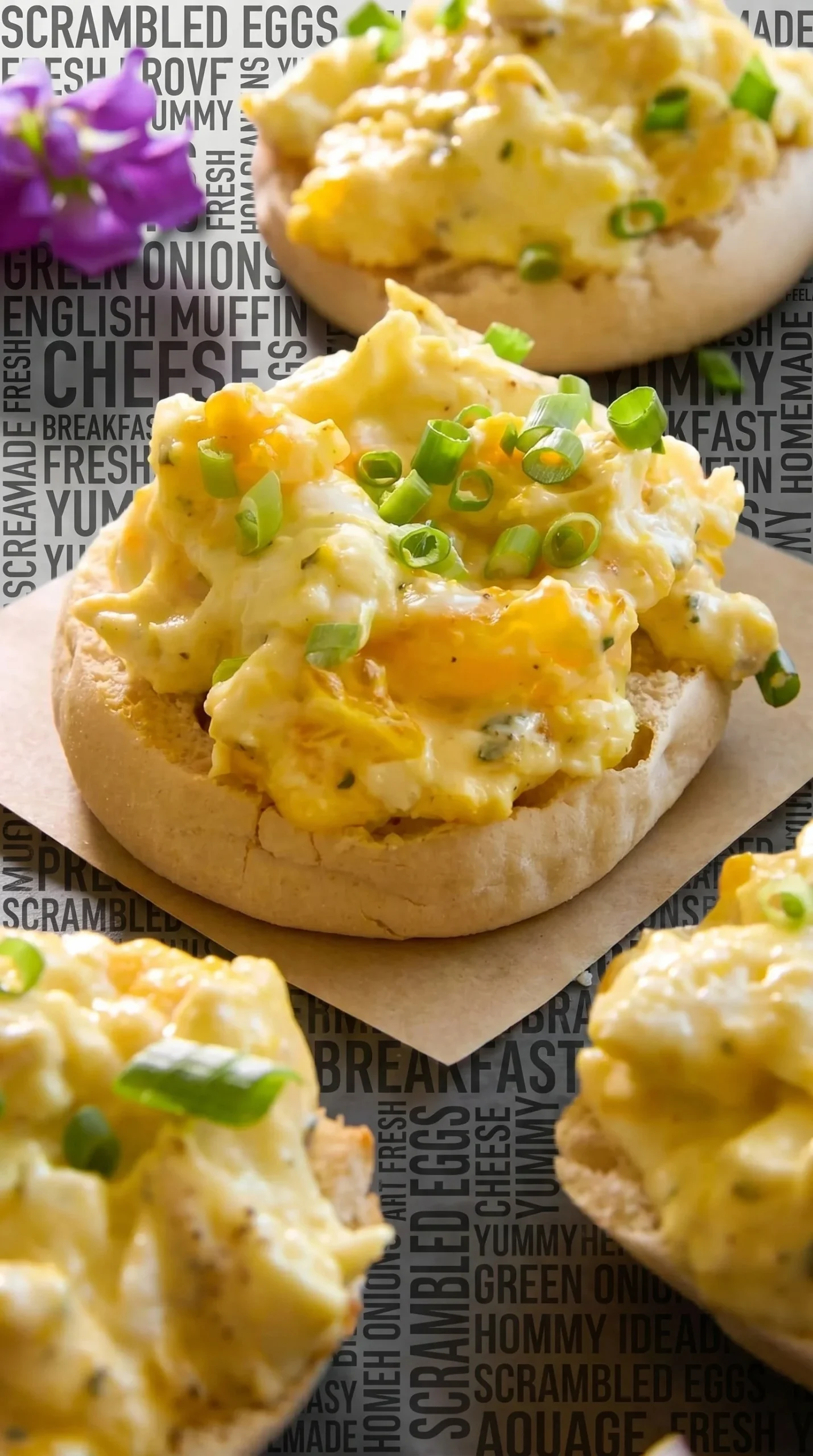 Plate of cheesy scrambled eggs topped with herbs and spices